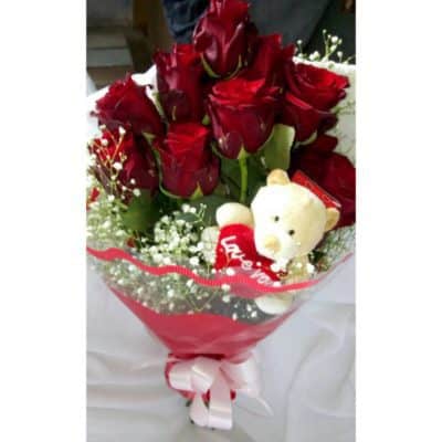 red roses with teddy